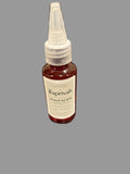 Bottle of Saprivah Scalp Elixir on a gray surface