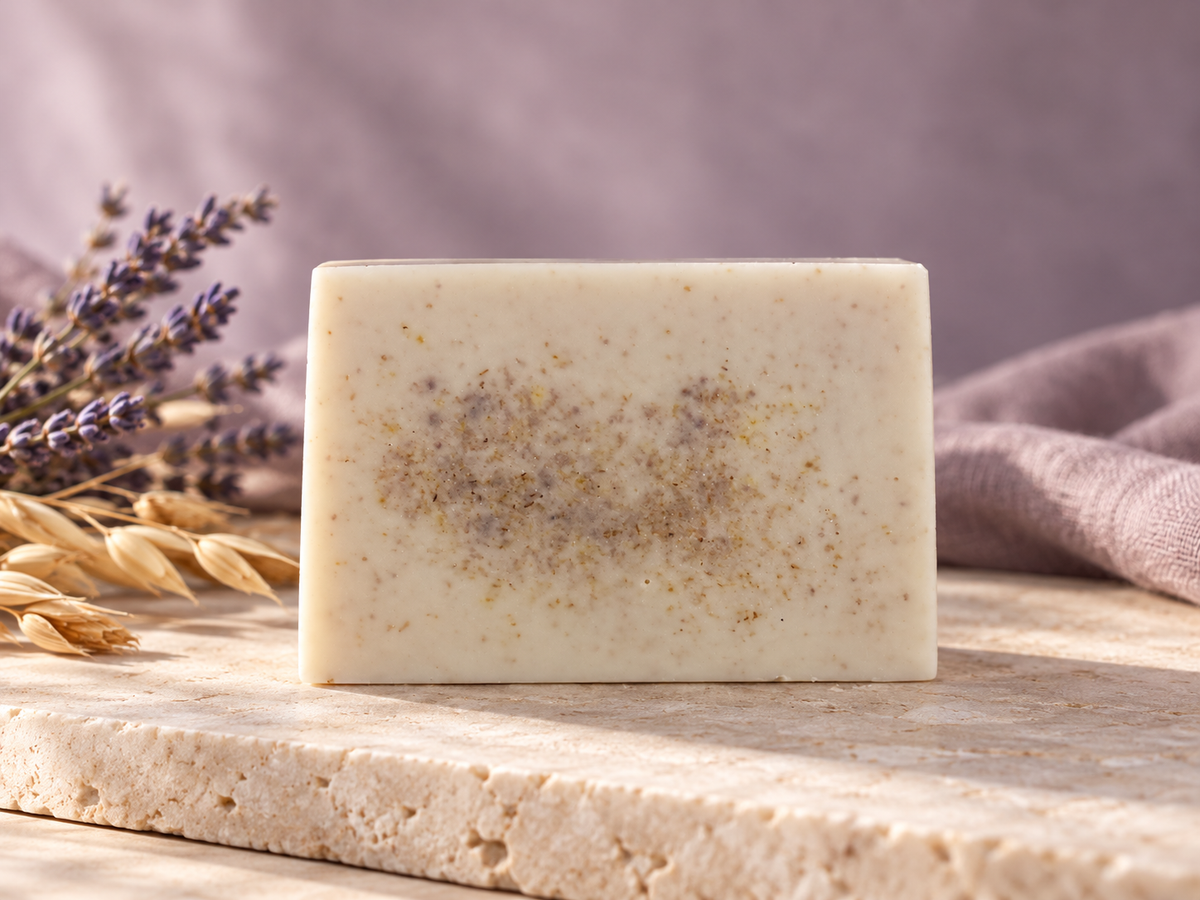 Velvet Calm artisan soap with natural marbling on an elegant lavender-toned spa background